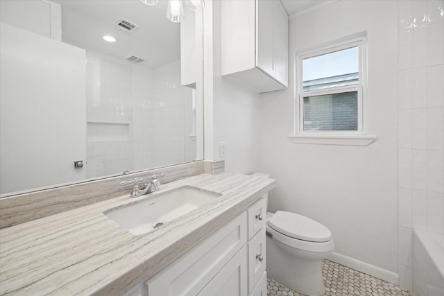 bathroom with tile patterned floors, vanity, and toilet