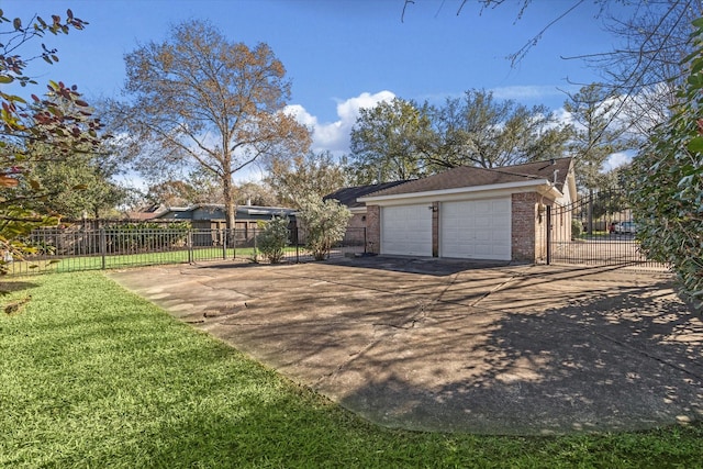 garage featuring a lawn