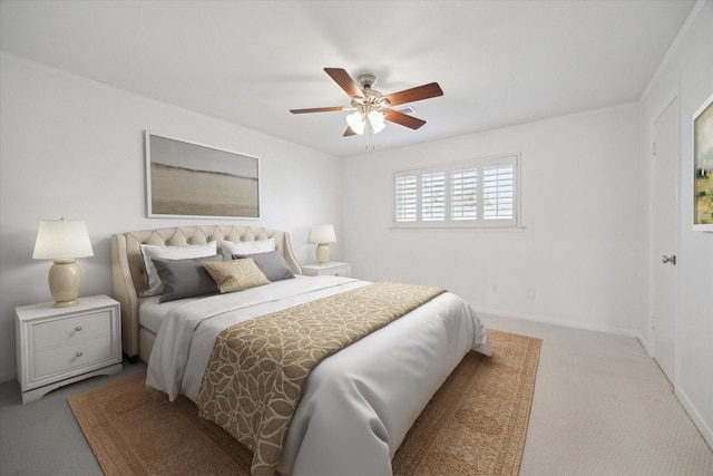 bedroom with light colored carpet and ceiling fan