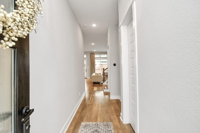 corridor featuring light hardwood / wood-style flooring