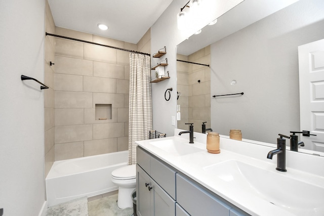 full bathroom featuring shower / bath combination with curtain, toilet, and vanity