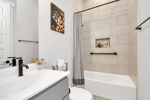 full bathroom featuring vanity, toilet, and shower / bathtub combination with curtain