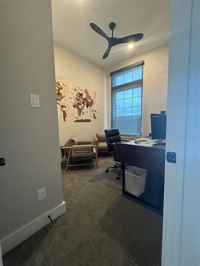 home office with dark colored carpet and ceiling fan