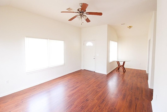 spare room featuring ceiling fan and dark wood-type flooring