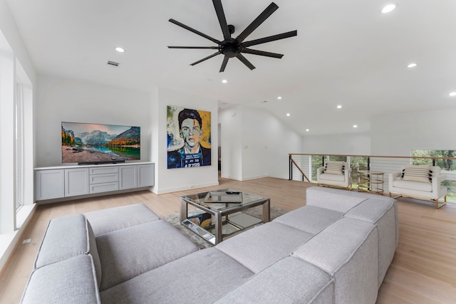 living room featuring ceiling fan, light hardwood / wood-style flooring, and a healthy amount of sunlight