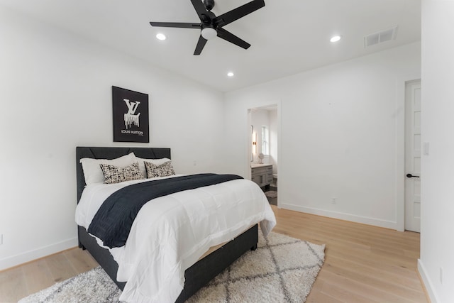 bedroom with connected bathroom, ceiling fan, and light hardwood / wood-style floors