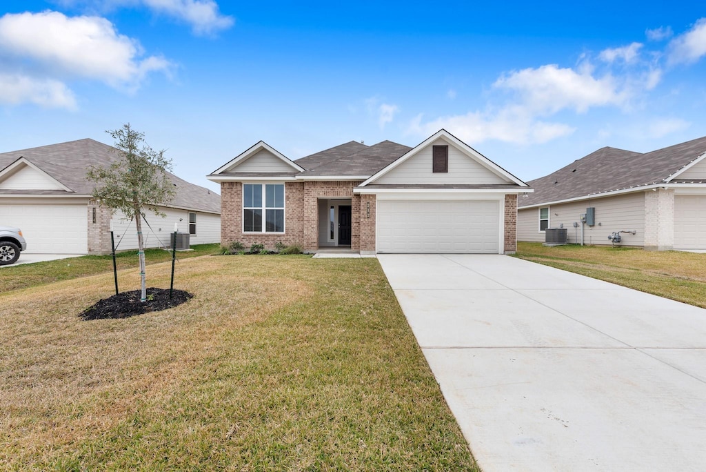 ranch-style house with a garage, central AC, and a front lawn