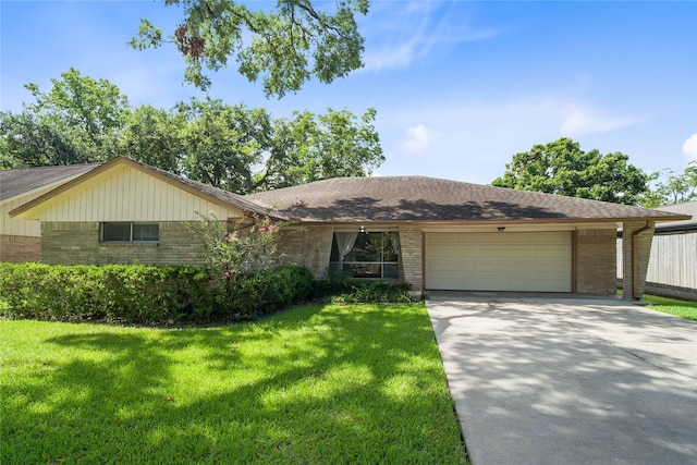 ranch-style home with a garage and a front lawn