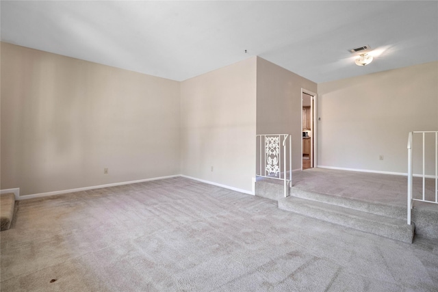 unfurnished living room featuring carpet floors