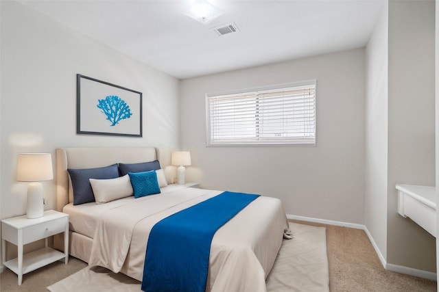 bedroom with light carpet