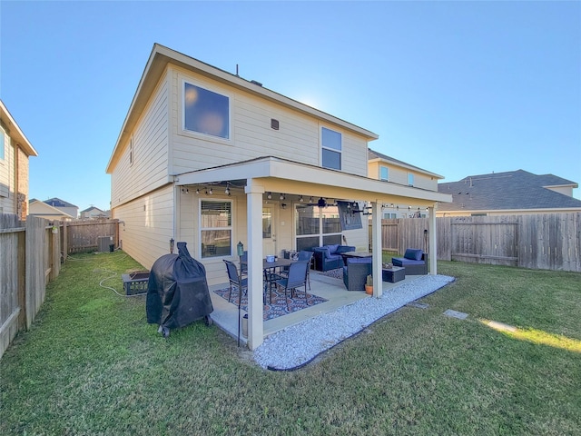 back of house featuring a lawn, central AC, ceiling fan, a patio, and outdoor lounge area