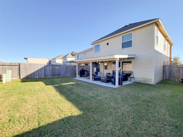 rear view of property featuring a patio, a lawn, and outdoor lounge area