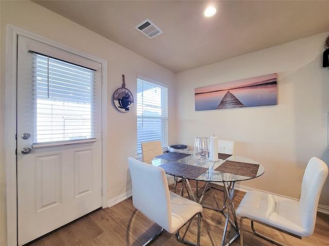 dining area featuring wood-type flooring