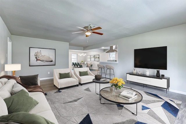 living room featuring ceiling fan and light wood-type flooring