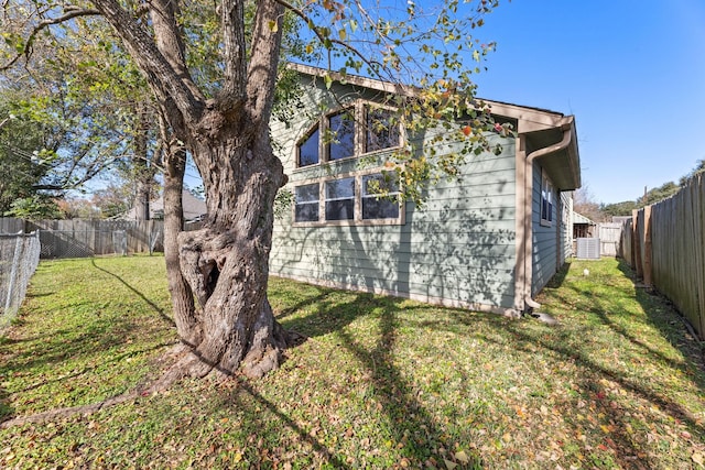 view of side of home featuring a yard