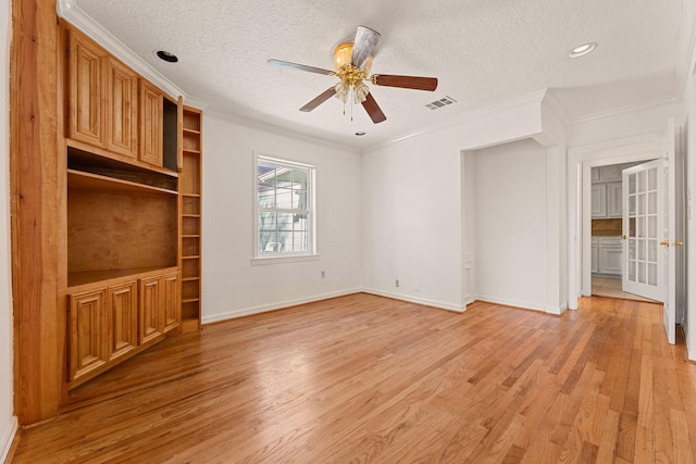 interior space featuring crown molding, ceiling fan, light hardwood / wood-style floors, and a textured ceiling