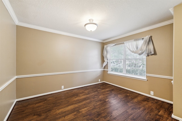 empty room featuring ornamental molding and dark wood-type flooring