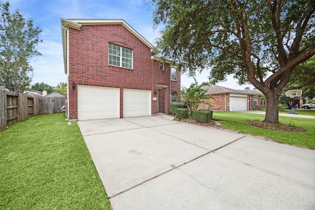 view of front of property featuring a garage and a front lawn