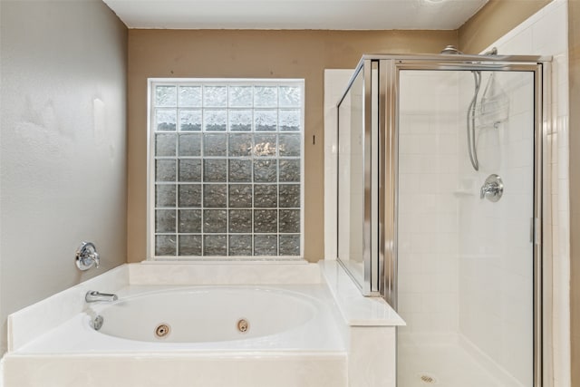 bathroom with shower with separate bathtub