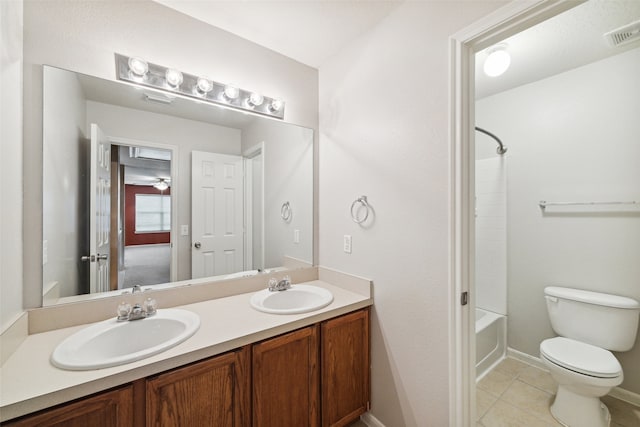 full bathroom with tile patterned floors, vanity,  shower combination, and toilet