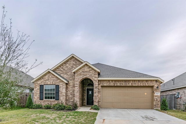 view of front of house with a front lawn and a garage