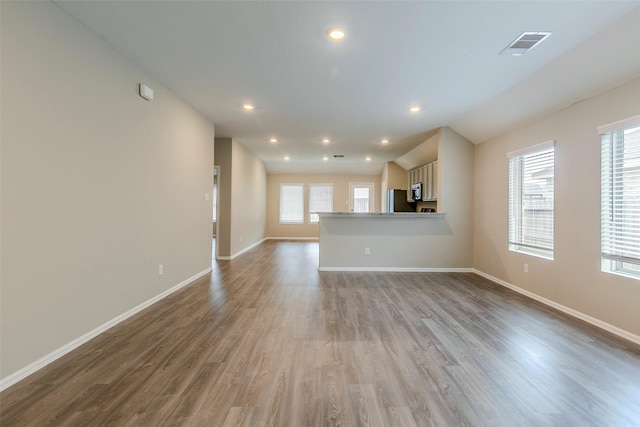 unfurnished living room with light hardwood / wood-style flooring