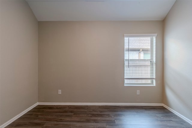 empty room with dark hardwood / wood-style floors