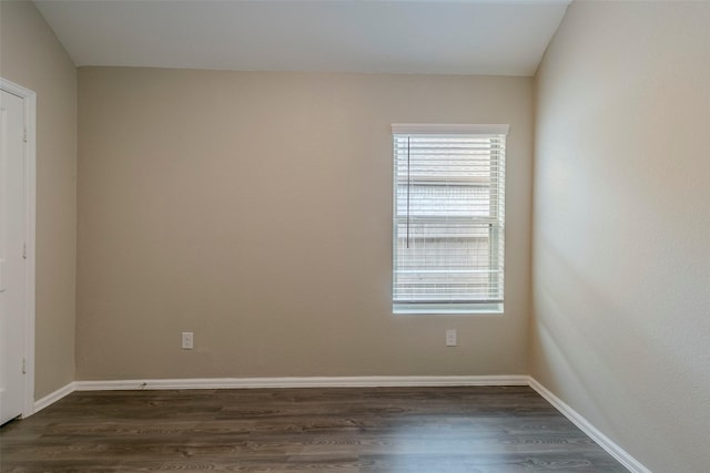 empty room with dark wood-type flooring