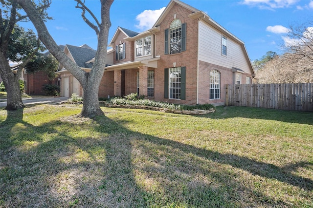 front of property with a garage and a front yard