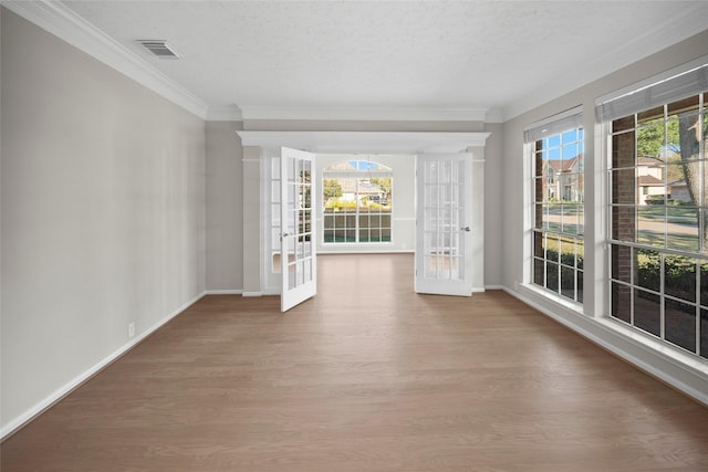 unfurnished sunroom featuring french doors