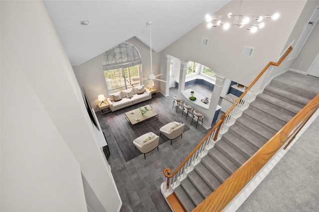 living room featuring high vaulted ceiling