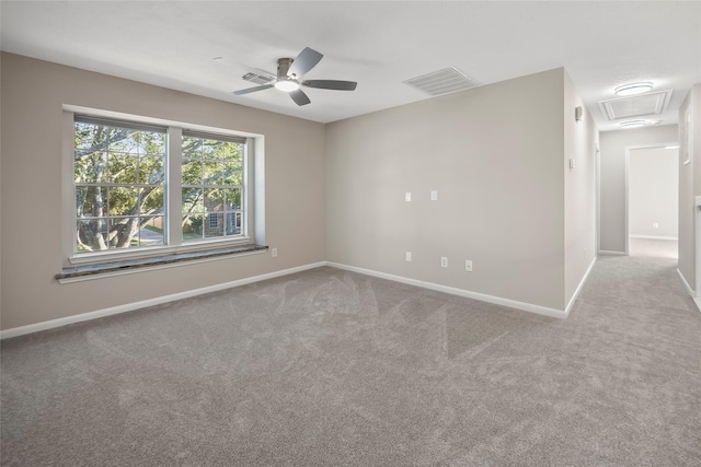 unfurnished room with ceiling fan and light colored carpet