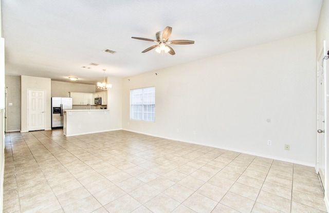 unfurnished living room with light tile patterned floors and ceiling fan with notable chandelier