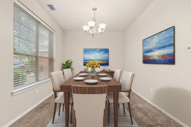 dining room featuring a chandelier