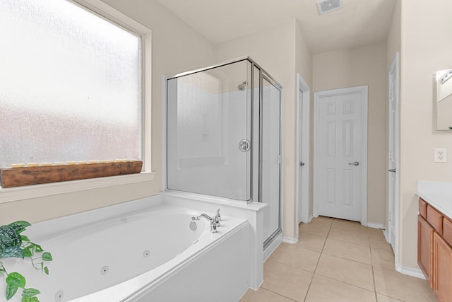 bathroom featuring tile patterned flooring, vanity, and separate shower and tub