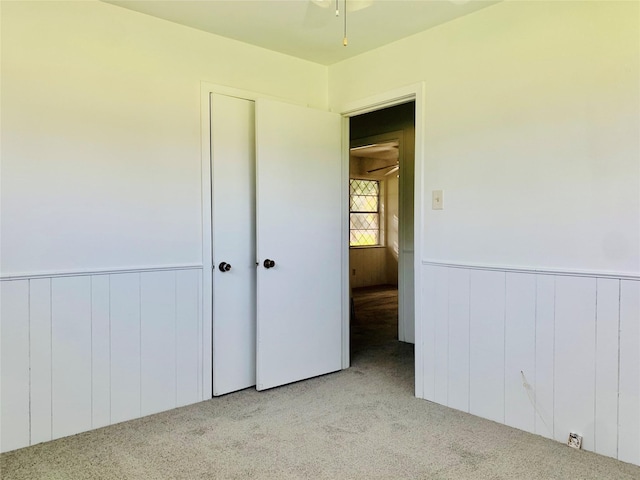 unfurnished bedroom with light carpet