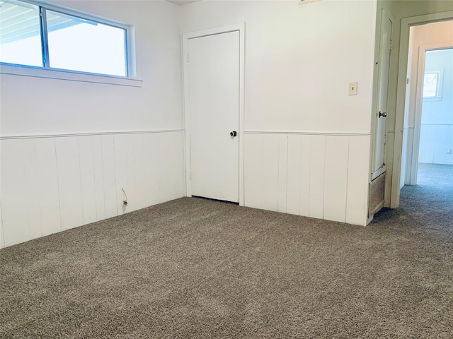 unfurnished room featuring carpet flooring