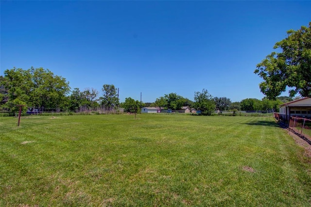 view of yard with a rural view