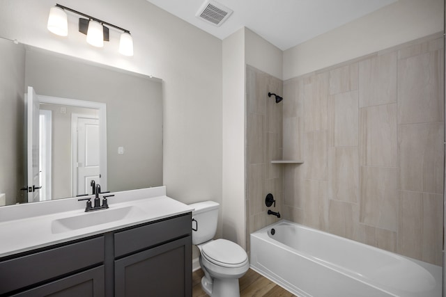 full bathroom with vanity, toilet, shower / bath combination, and wood-type flooring