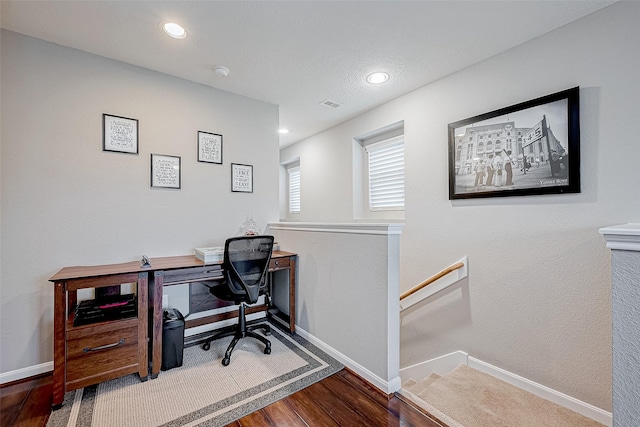 office space with wood-type flooring