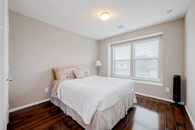 bedroom featuring dark hardwood / wood-style floors