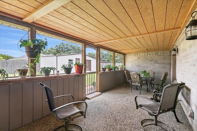 sunroom with wooden ceiling