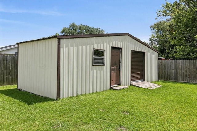 view of outdoor structure with a lawn