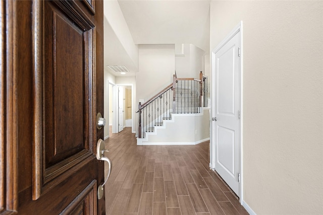 foyer entrance with dark hardwood / wood-style floors