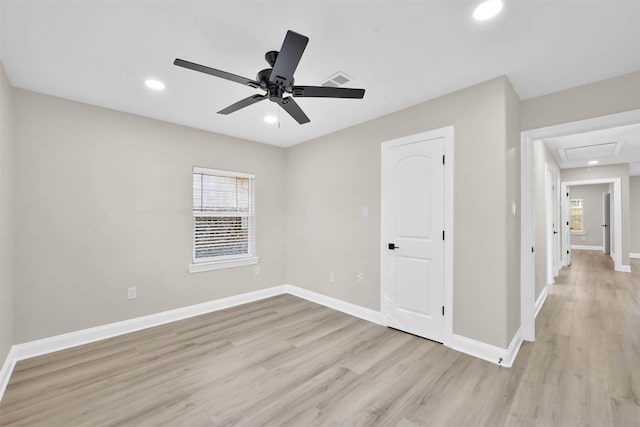 spare room featuring ceiling fan and light wood-type flooring