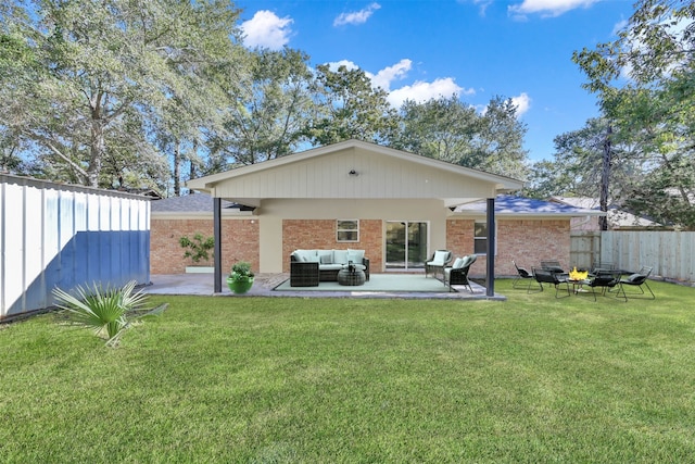 back of property with an outdoor hangout area, a patio, and a yard