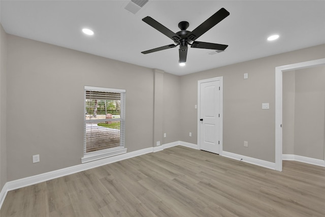 unfurnished room featuring light wood-type flooring and ceiling fan