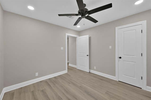 unfurnished bedroom featuring ceiling fan and light wood-type flooring