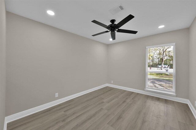 unfurnished room with ceiling fan and light hardwood / wood-style floors