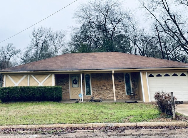 single story home with a front yard, a garage, and covered porch